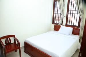 Ένα ή περισσότερα κρεβάτια σε δωμάτιο στο Khách sạn TNK