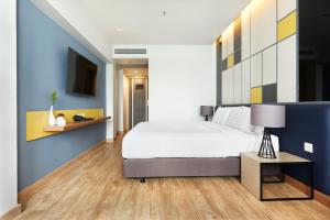 Ein Bett oder Betten in einem Zimmer der Unterkunft The Quarter Ladprao by UHG