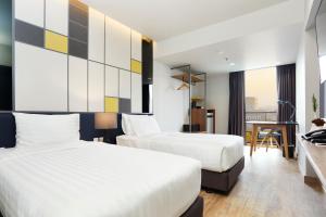 Ein Bett oder Betten in einem Zimmer der Unterkunft The Quarter Ladprao by UHG