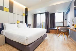 Ein Bett oder Betten in einem Zimmer der Unterkunft The Quarter Ladprao by UHG