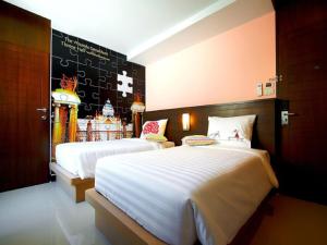 Postel nebo postele na pokoji v ubytování Ds67 Suites + 22 fotografií