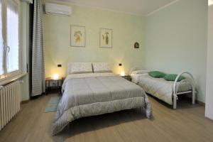 A bed or beds in a room at Casa Malìca