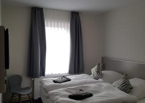 Postel nebo postele na pokoji v ubytování Hotel Silbertanne