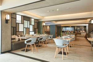 Ein Restaurant oder anderes Speiselokal in der Unterkunft The Quarter Ladprao by UHG 