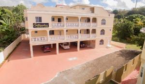 an aerial view of a house with a balcony at Calliandras Apartment Complex in Kingstown
