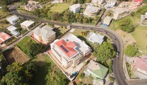 an overhead view of a house with a road at Calliandras Apartment Complex in Kingstown