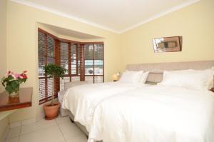 Ένα ή περισσότερα κρεβάτια σε δωμάτιο στο Rivonia One & Only +21 φωτογραφίες