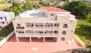 an aerial view of a house with a balcony at Calliandras Apartment Complex in Kingstown
