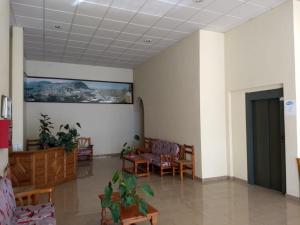 a room with chairs and a table and a ceiling at Hostal Nicol's in Luque