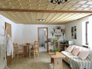 a living room with a couch and a table at Ferienhaus am Kagerstein in Neukirchen beim Heiligen Blut