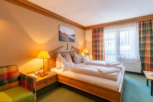 Postelja oz. postelje v sobi nastanitve SCOL Sporthotel Zillertal