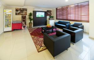 a living room with two couches and a tv at Eastren Front in Al Khobar