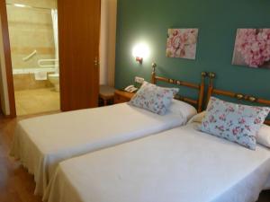 Rúm í herbergi á Hotel Nice