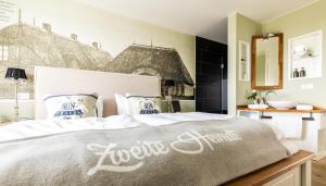 Postel nebo postele na pokoji v ubytování Hotel Zweite Heimat