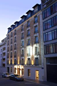 a large building with a large window on the side of it at Best Western Plus 61 Paris Nation Hotel in Paris