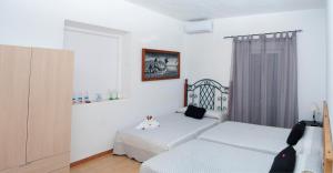 Postel nebo postele na pokoji v ubytování Hostal Batato