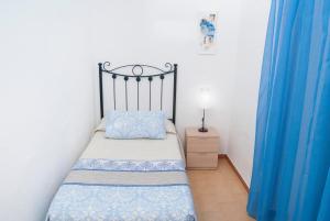 Postel nebo postele na pokoji v ubytování Hostal Batato