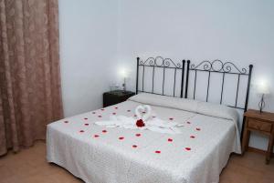 Postel nebo postele na pokoji v ubytování Hostal Batato