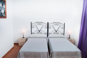 Postel nebo postele na pokoji v ubytování Hostal Batato