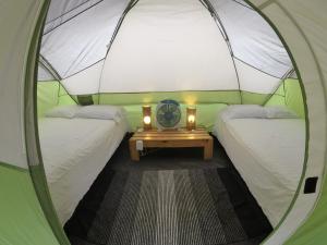 Rúm í herbergi á Cabalonga EcoAdventure