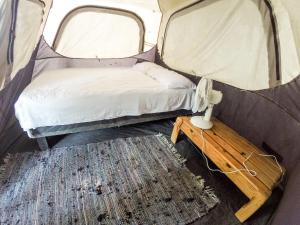 Rúm í herbergi á Cabalonga EcoAdventure