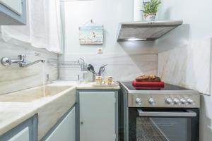 Kuchyňa alebo kuchynka v ubytovaní My Athens Gem + 37 fotografií
