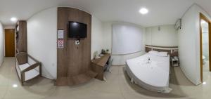 Postel nebo postele na pokoji v ubytování San Lucas Hotel