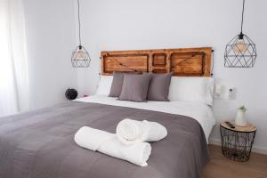 Postel nebo postele na pokoji v ubytování GOMEZ ROOMS