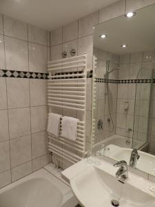 Ванна кімната в Garni Hotel Moselschild