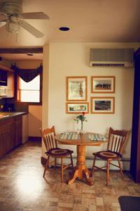a kitchen with a table and chairs in a room at HIllside Farm B & B in Mount Joy