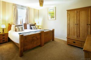 A bed or beds in a room at The Old Hall Inn 