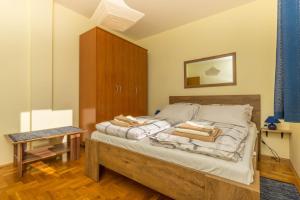 Posteľ alebo postele v izbe v ubytovaní Apartmani Adria LiLa Crikvenica Dramalj