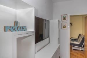 Televízia a/alebo spoločenská miestnosť v ubytovaní Apartmani Adria LiLa Crikvenica Dramalj