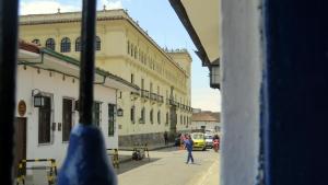 a view from a window of a street with buildings at Lienzo Hostel and Mural Art Museum in Popayan