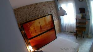 Łóżko lub łóżka w pokoju w obiekcie Hostal Hispalense