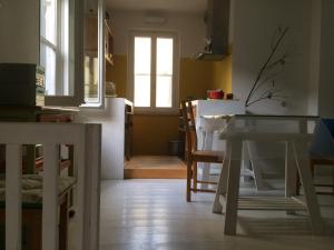 a kitchen and dining room with a table and chairs at Blu Klein in Foligno +19 photos