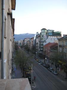 a view of a city street with cars and buildings at Maria Louisa Apartment in Sofia