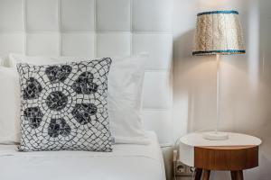 Postel nebo postele na pokoji v ubytování Loulé Coreto Guesthouse