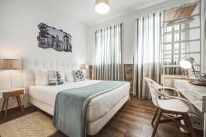 Postel nebo postele na pokoji v ubytování Loulé Coreto Guesthouse