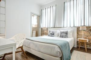 Postel nebo postele na pokoji v ubytování Loulé Coreto Guesthouse