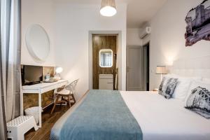 Postel nebo postele na pokoji v ubytování Loulé Coreto Guesthouse
