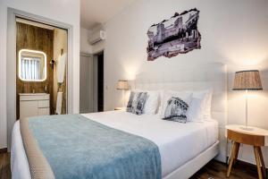 Postel nebo postele na pokoji v ubytování Loulé Coreto Guesthouse