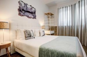 Postel nebo postele na pokoji v ubytování Loulé Coreto Guesthouse