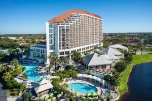 an aerial view of a resort with a pool at Naples Grande Beach Resort in Naples
