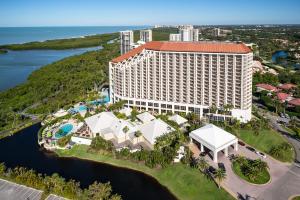 an aerial view of the resort with the ocean in the background at Naples Grande Beach Resort in Naples