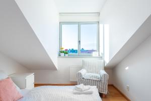 Postel nebo postele na pokoji v ubytování Nest Apartment