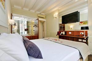 Letto o letti in una camera di Piazza Venezia Grand Suite