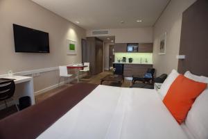 Krevet ili kreveti u jedinici u objektu Paseo La Galería Hotel & Suites