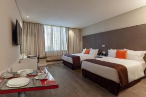 Krevet ili kreveti u jedinici u objektu Paseo La Galería Hotel & Suites