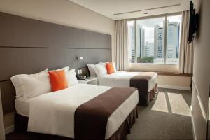 Krevet ili kreveti u jedinici u objektu Paseo La Galería Hotel & Suites
